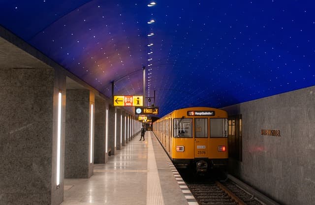 a woman gets off the train 